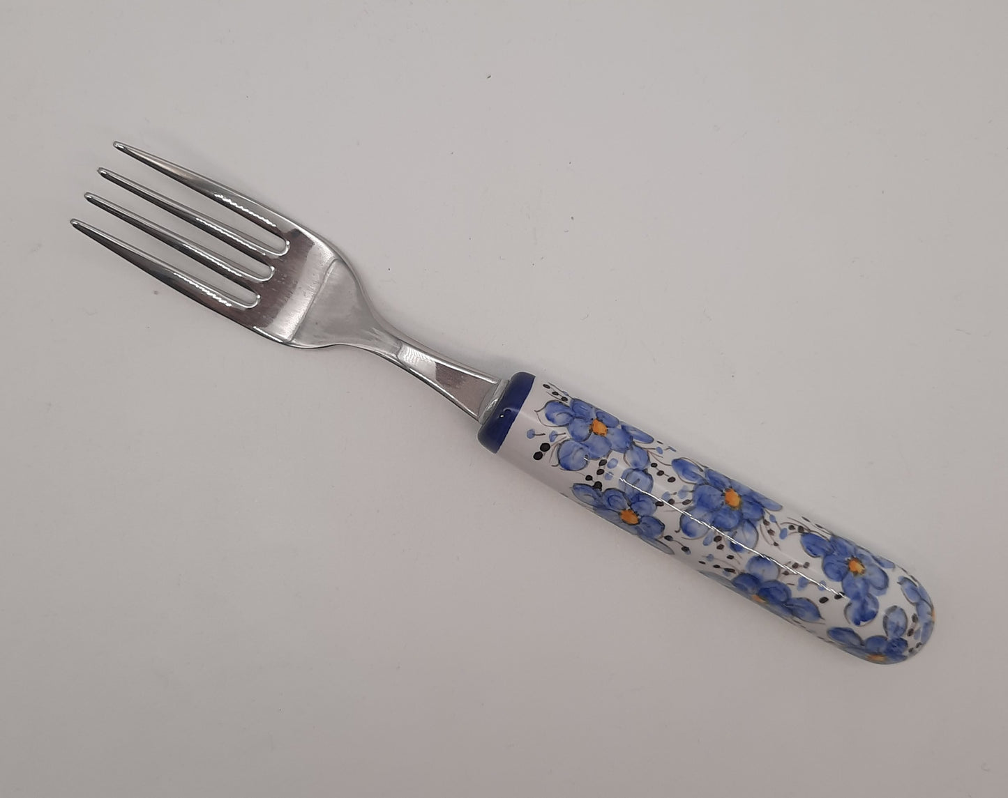Table fork with blue flowers decoration